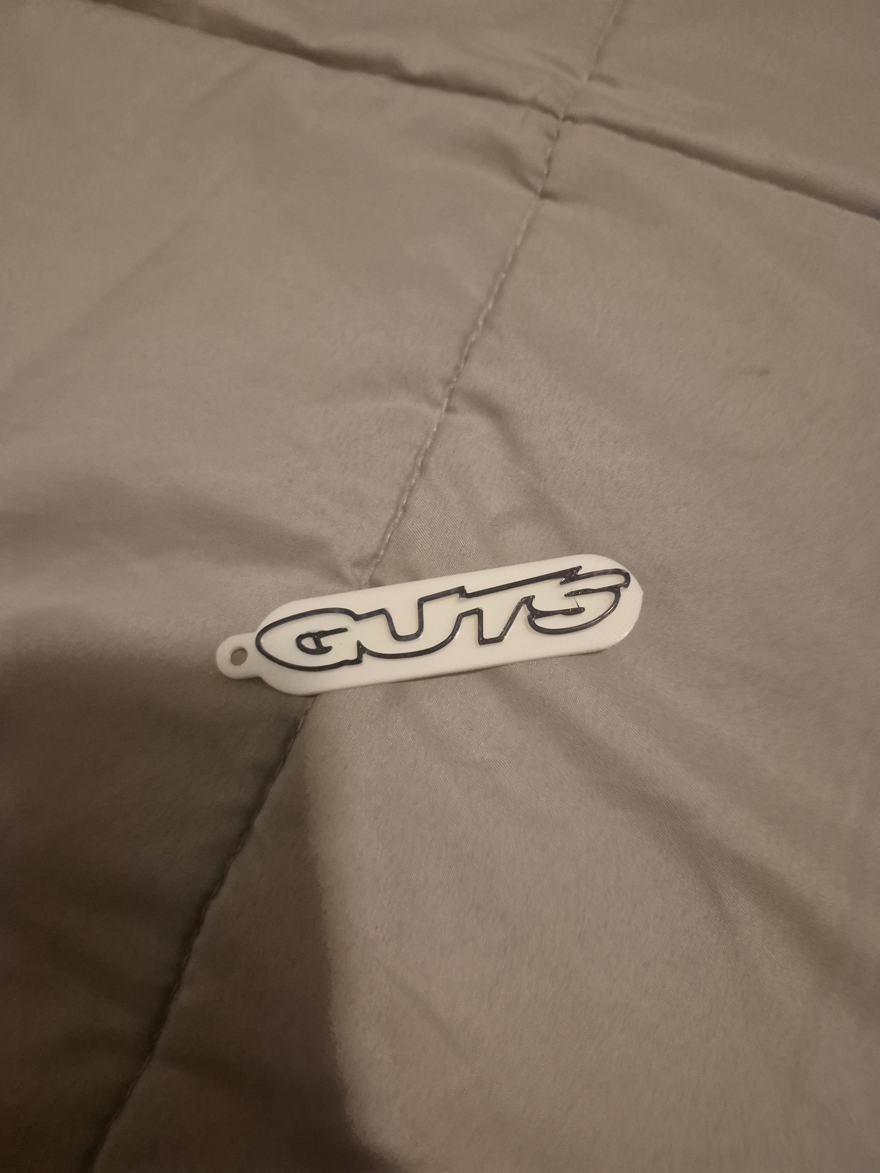Guts white keychain